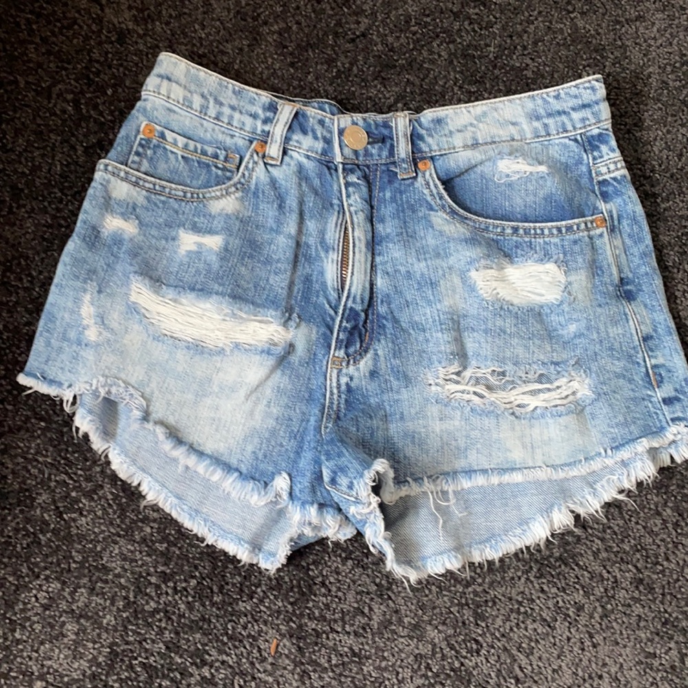 Size 5 distressed denim Garage shorts.